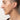 Closeup of woman modeling gold domed oval stud earring