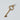 Gold Tiffany and Company key pendant