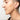 Close up of woman modeling large gold hoops with machined texture