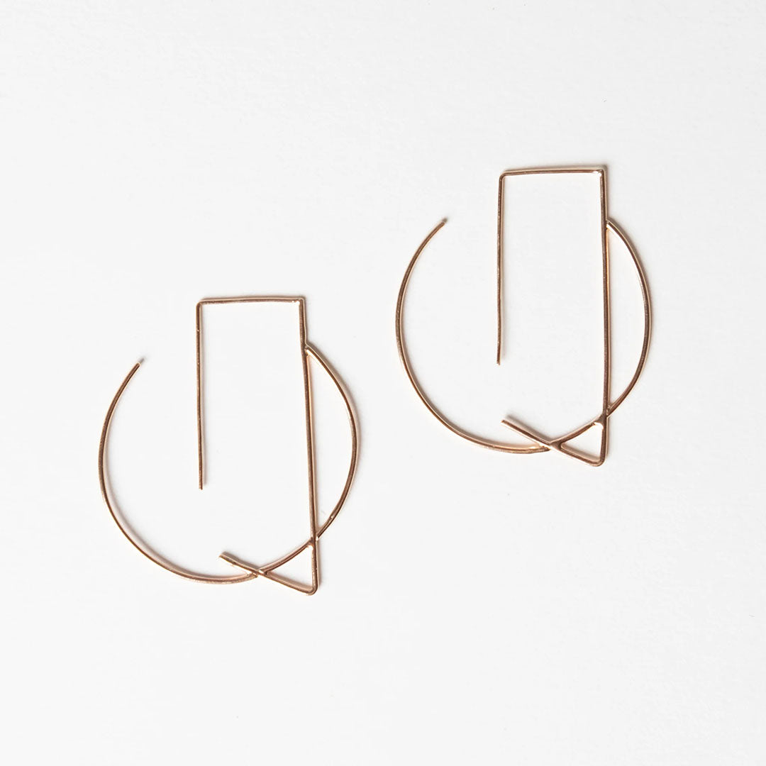 Delicate, gold hoop earrings by Truss and Ore