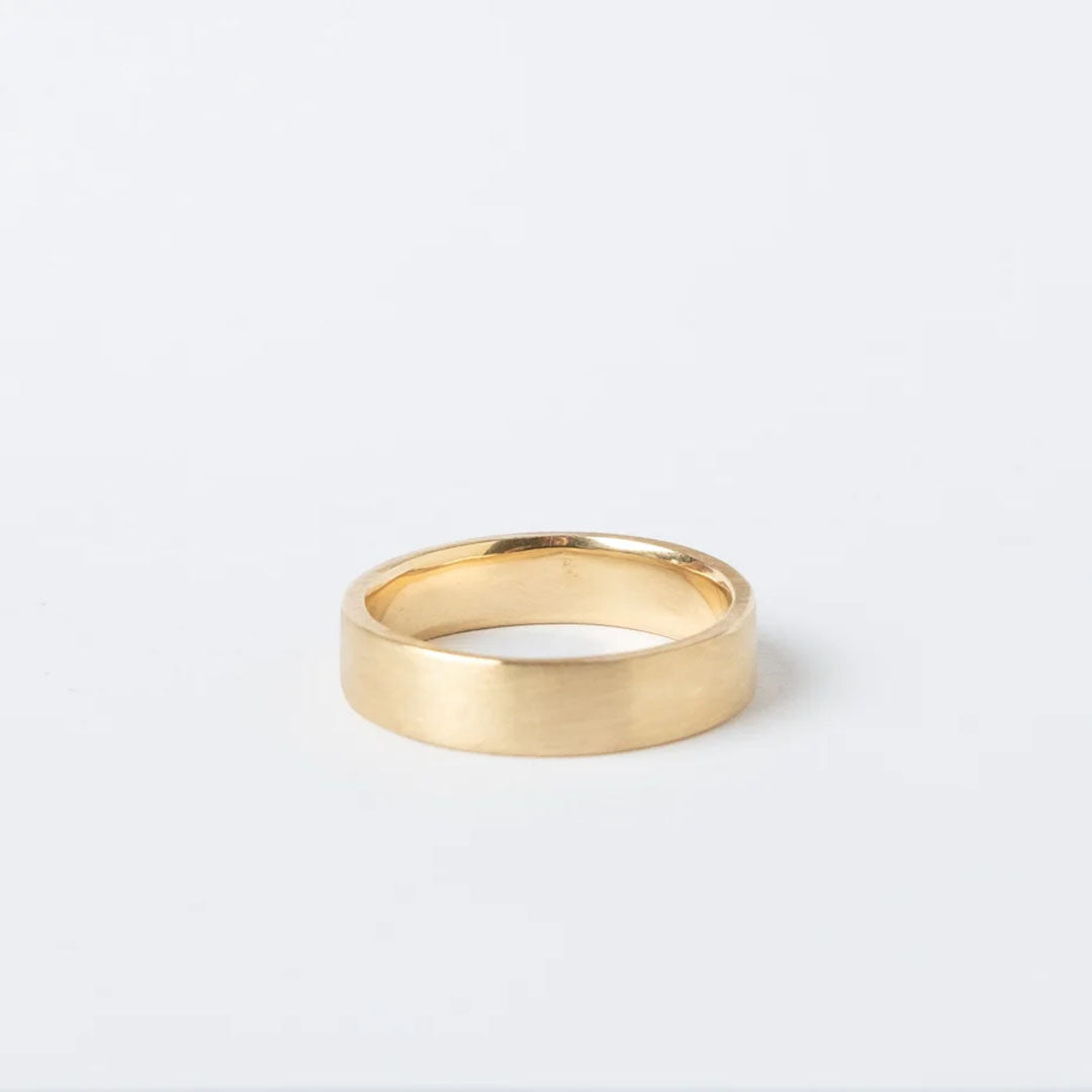 Custom, flat ring band in 18k gold by Truss and Ore